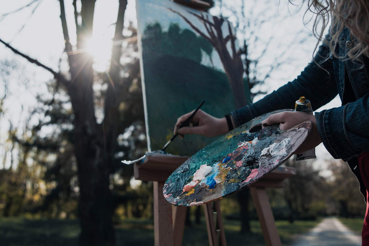 An artist painting a tree